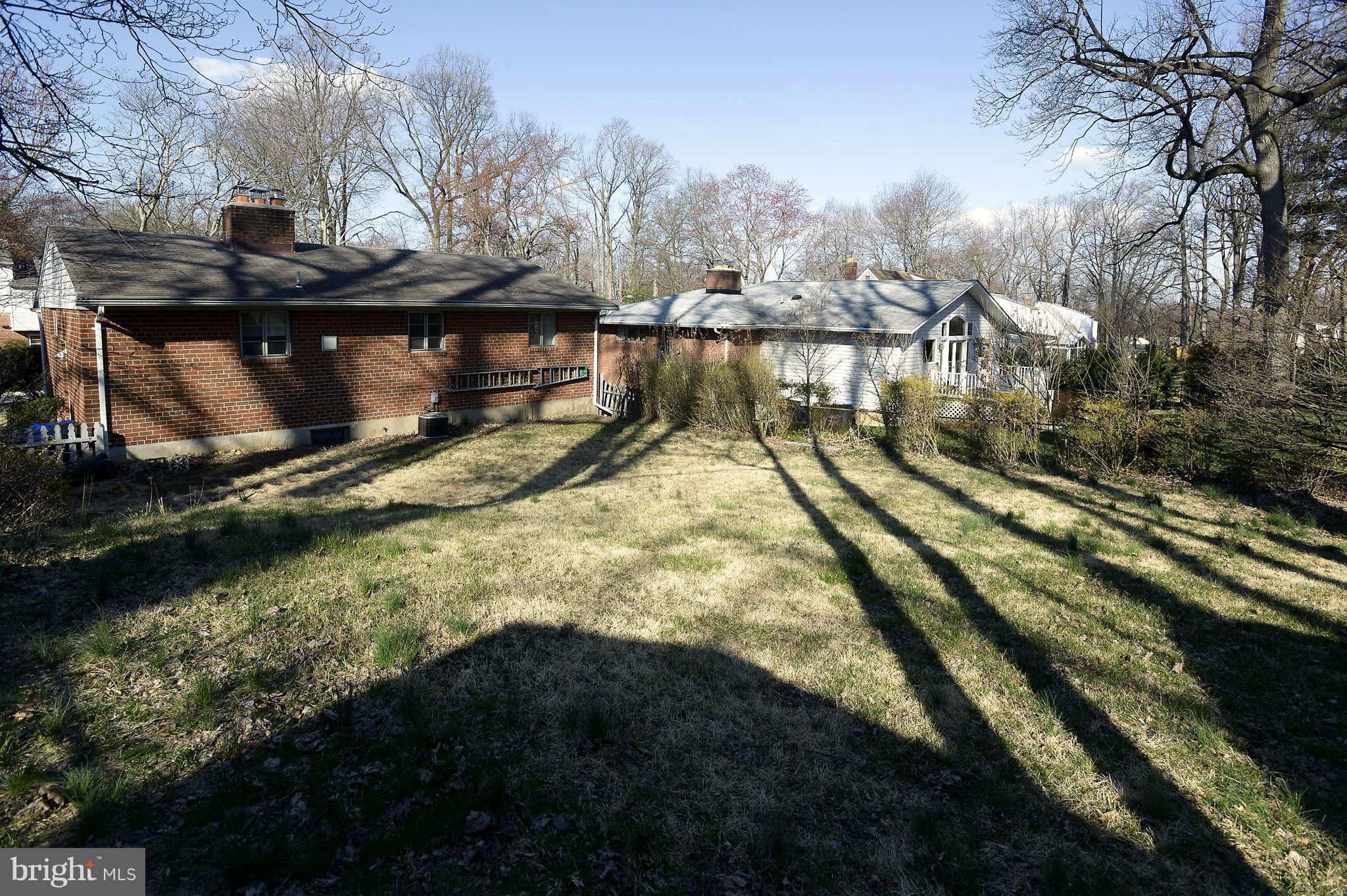 3913 Isbell Street Silver Spring, MD 20906 - Photo 22 of 23 a view of a house with a yard next to a lake