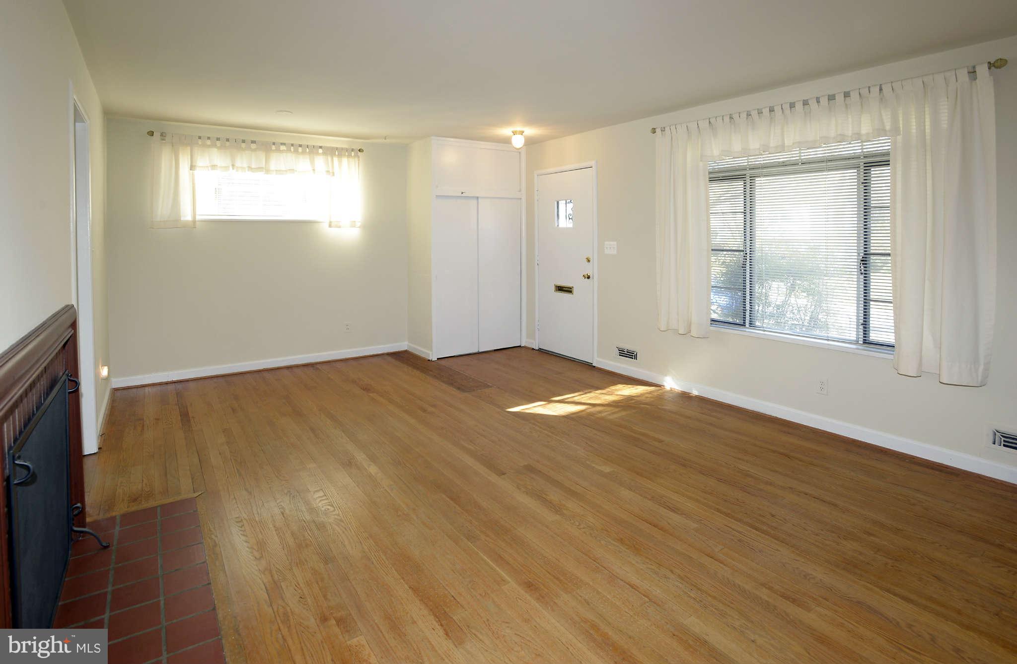 3913 Isbell Street Silver Spring, MD 20906 - Photo 5 of 23 a view of empty room with wooden floor and fan
