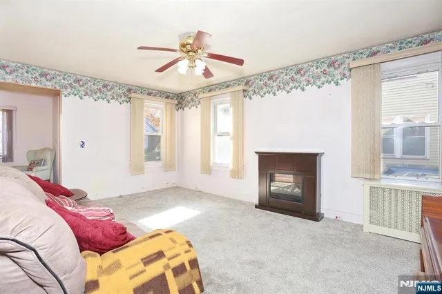 a bedroom with a bed and a fireplace