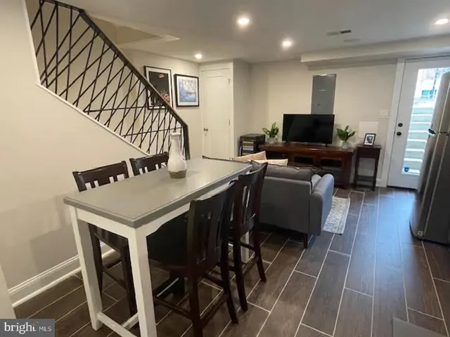 a view of a livingroom with furniture and a flat screen tv