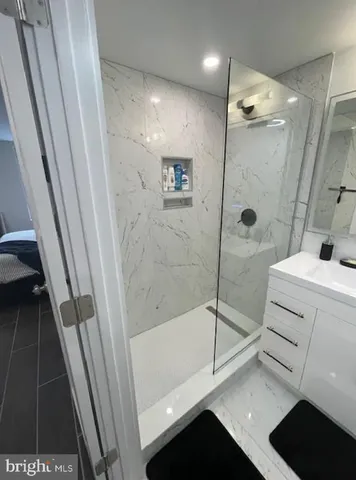 a bathroom with a sink and a shower