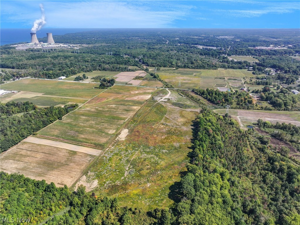 3320 Perry Park Road Perry, OH 44081 - Photo 4 of 5 Expansive land parcel with varied topography, including wooded areas and cleared fields