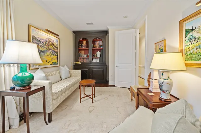 a living room with furniture and a lamp