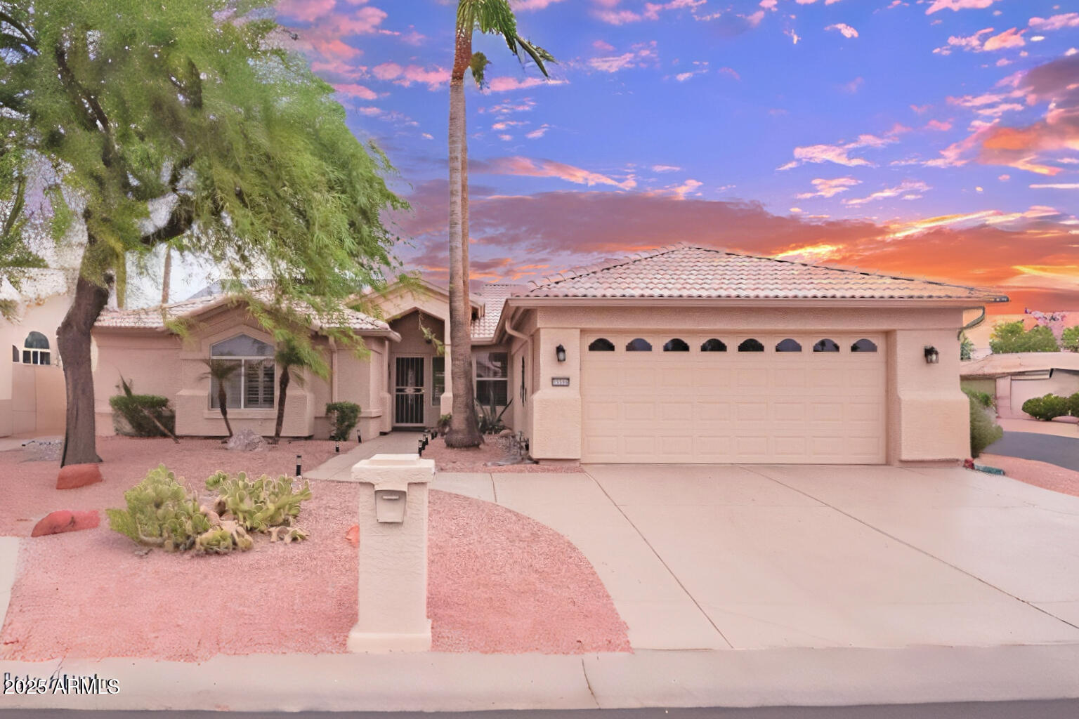 15596 West Flower Court Goodyear, AZ 85395 - Photo 1 of 35 a view of a white house with a large tree