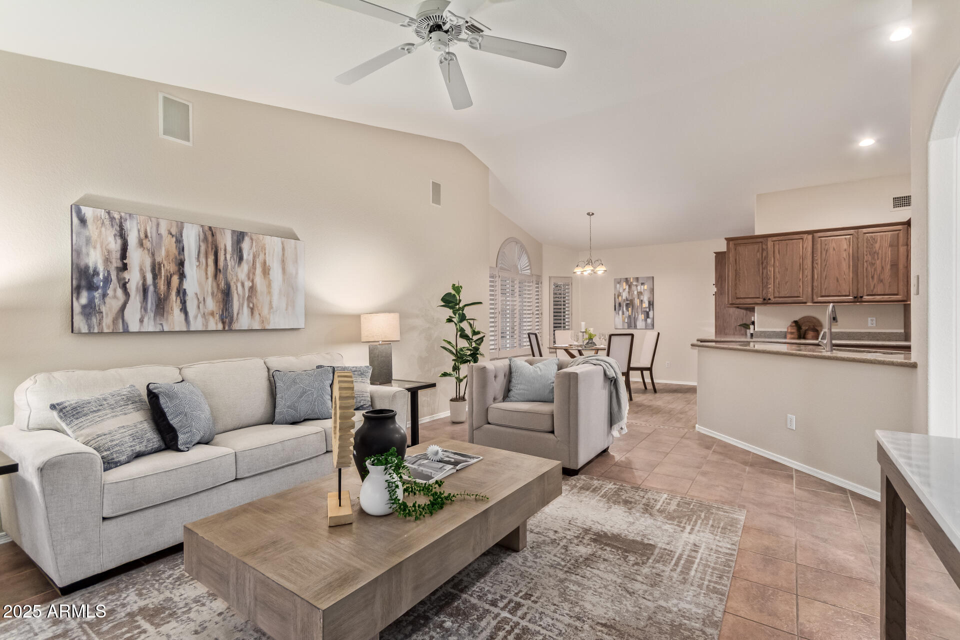 15596 West Flower Court Goodyear, AZ 85395 - Photo 12 of 35 a living room with furniture and kitchen view