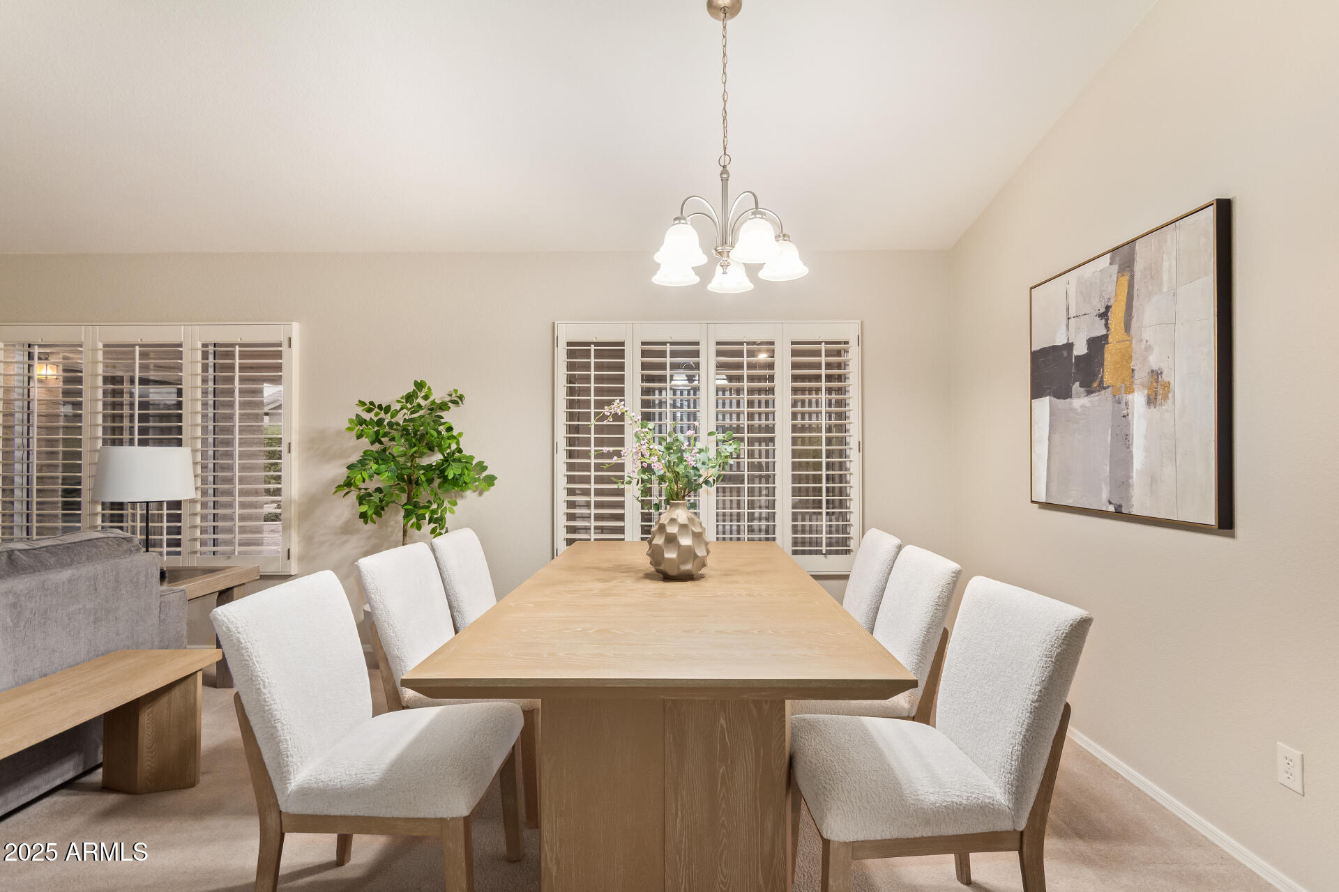 15596 West Flower Court Goodyear, AZ 85395 - Photo 14 of 35 a dining room with furniture window and wooden floor