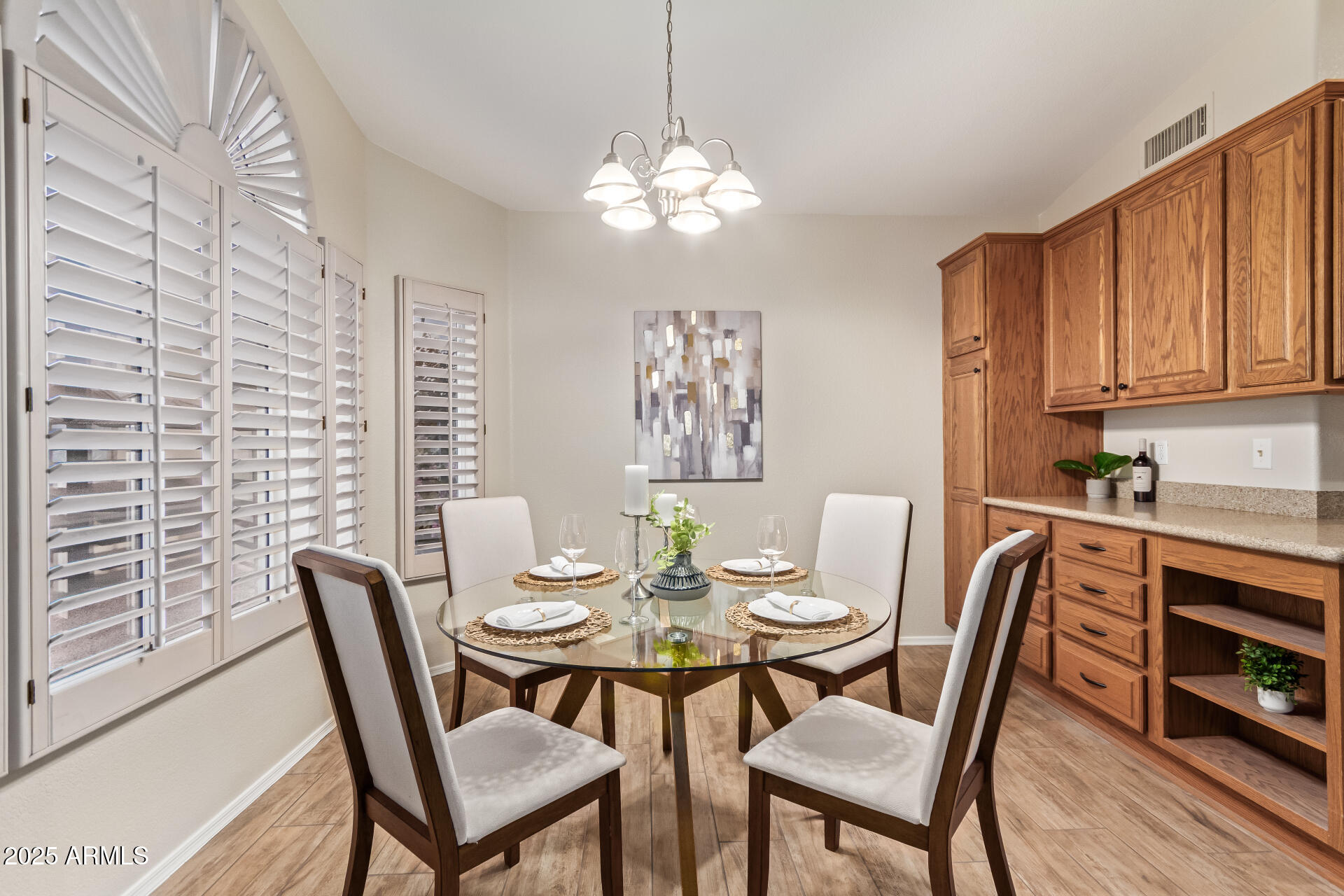 15596 West Flower Court Goodyear, AZ 85395 - Photo 16 of 35 a dining room with furniture and window