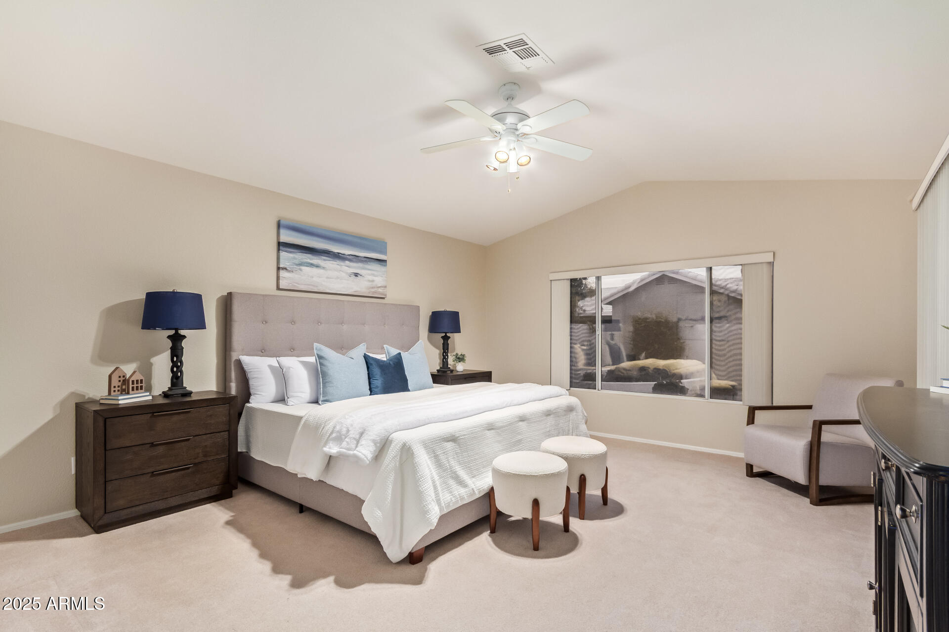 15596 West Flower Court Goodyear, AZ 85395 - Photo 20 of 35 a bedroom with a bed and a large mirror