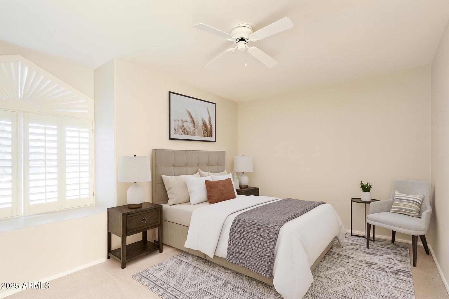 15596 West Flower Court Goodyear, AZ 85395 - Photo 26 of 35 a bedroom with a bed a couch and a window