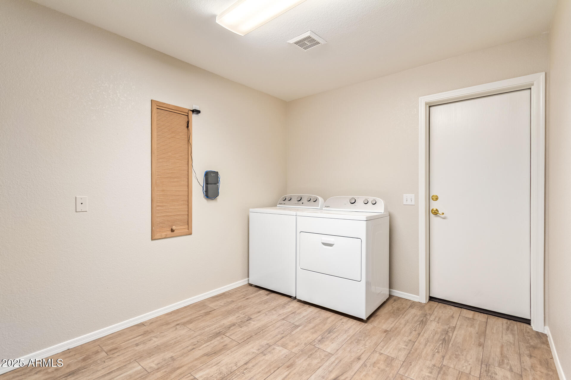 15596 West Flower Court Goodyear, AZ 85395 - Photo 29 of 35 a utility room with a sink dryer and washer