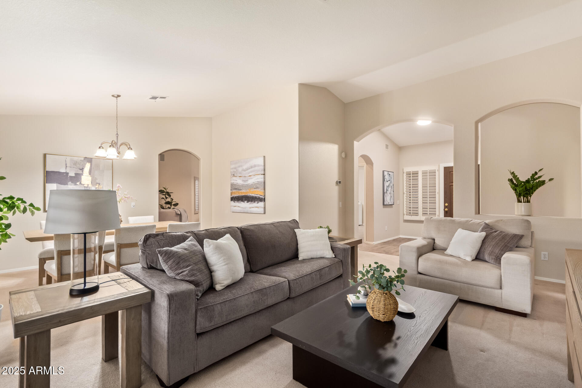 15596 West Flower Court Goodyear, AZ 85395 - Photo 3 of 35 a living room with furniture and wooden floor