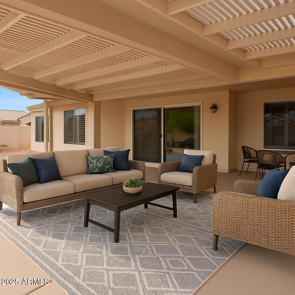15596 West Flower Court Goodyear, AZ 85395 - Photo 32 of 35 a living room with furniture and a rug