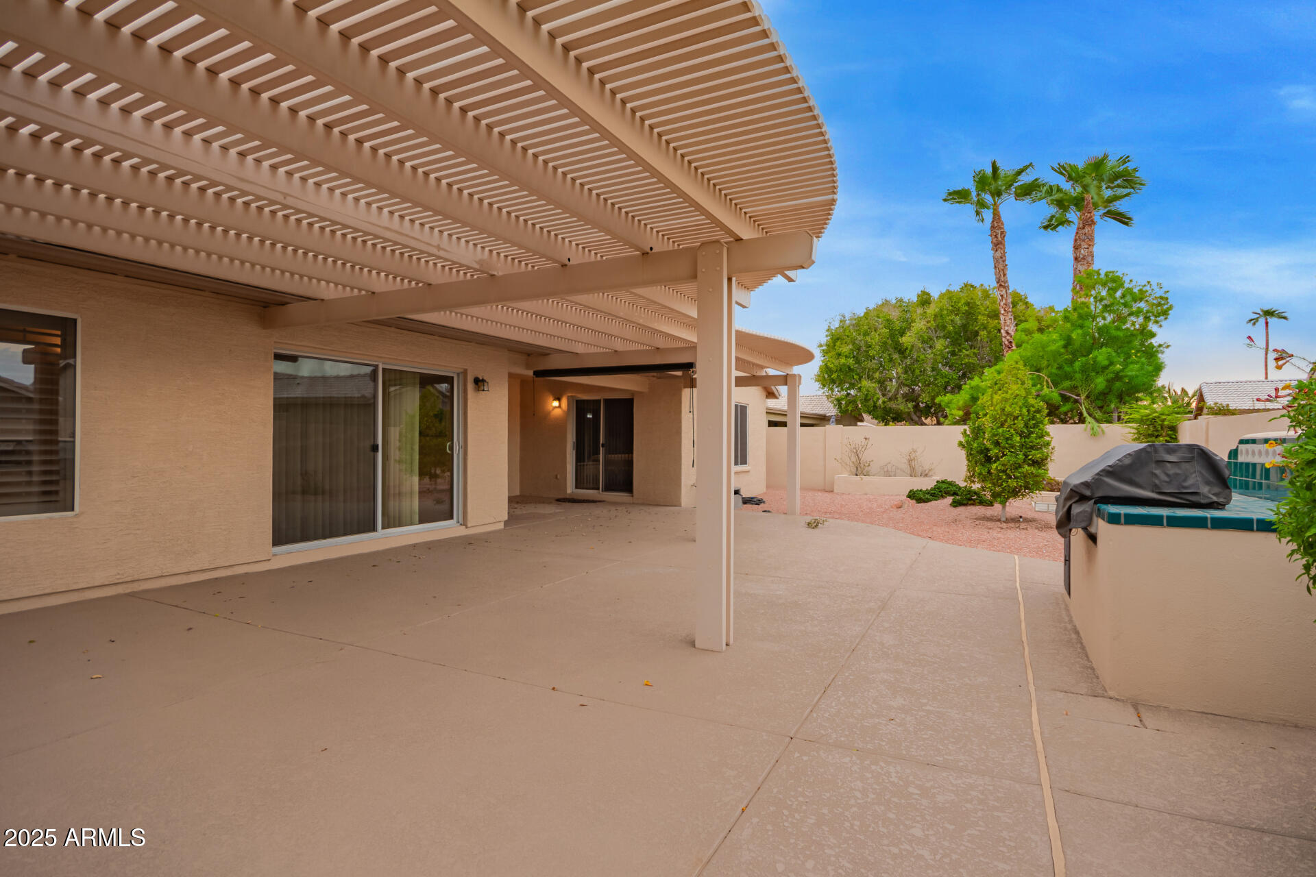 15596 West Flower Court Goodyear, AZ 85395 - Photo 33 of 35 a view of a house with a patio