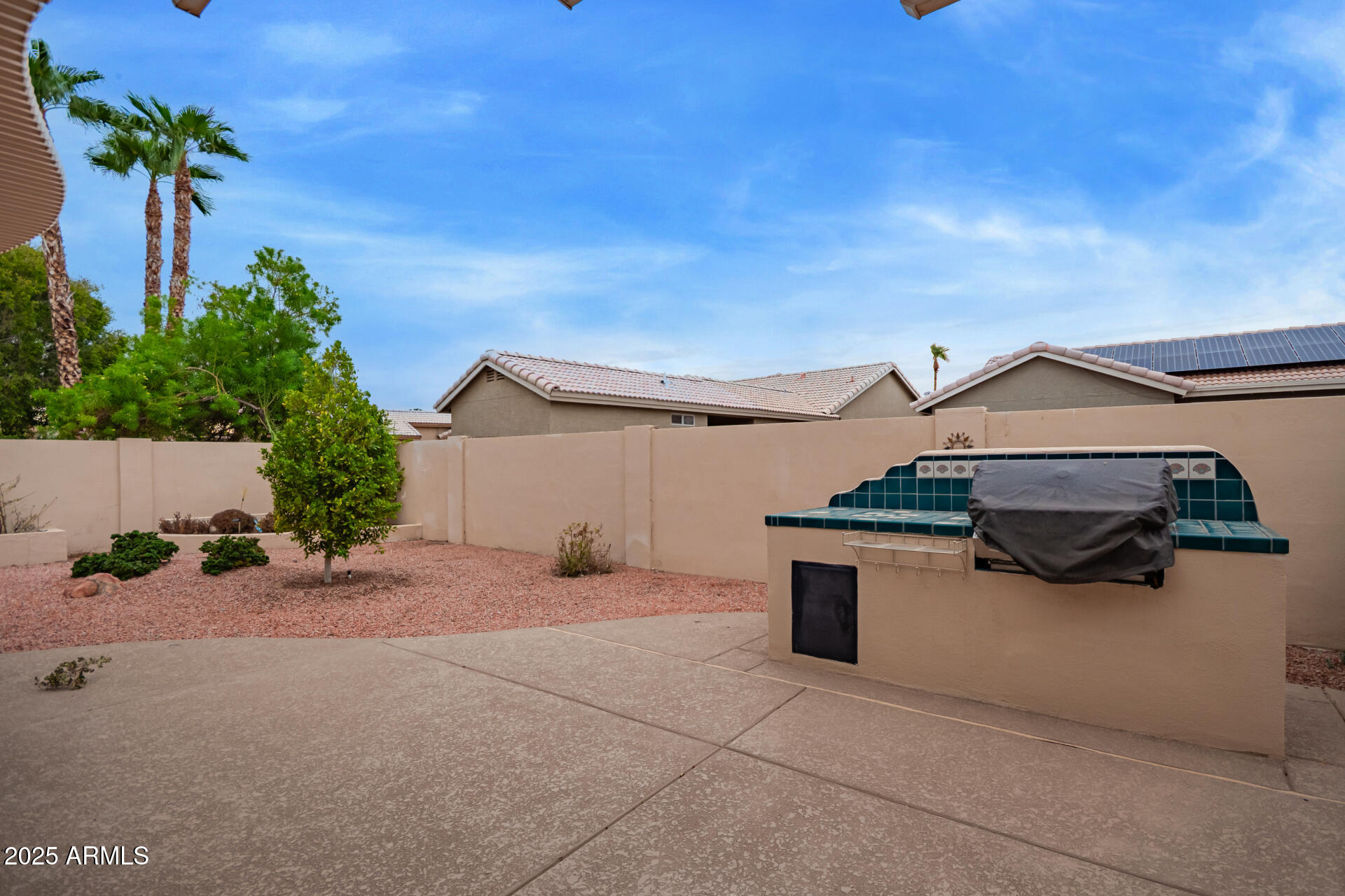 15596 West Flower Court Goodyear, AZ 85395 - Photo 34 of 35 a view of a terrace with a garden and deck