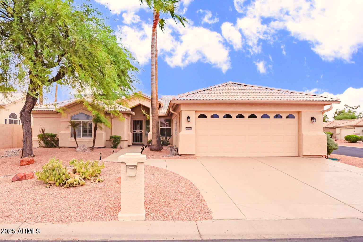 15596 West Flower Court Goodyear, AZ 85395 - Photo 35 of 35 a front view of a building with garden