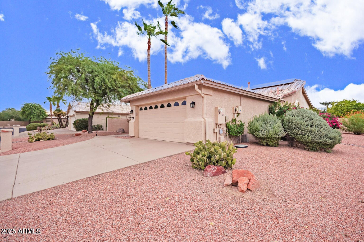 15596 West Flower Court Goodyear, AZ 85395 - Photo 4 of 35 a sign that is sitting in front of yellow house