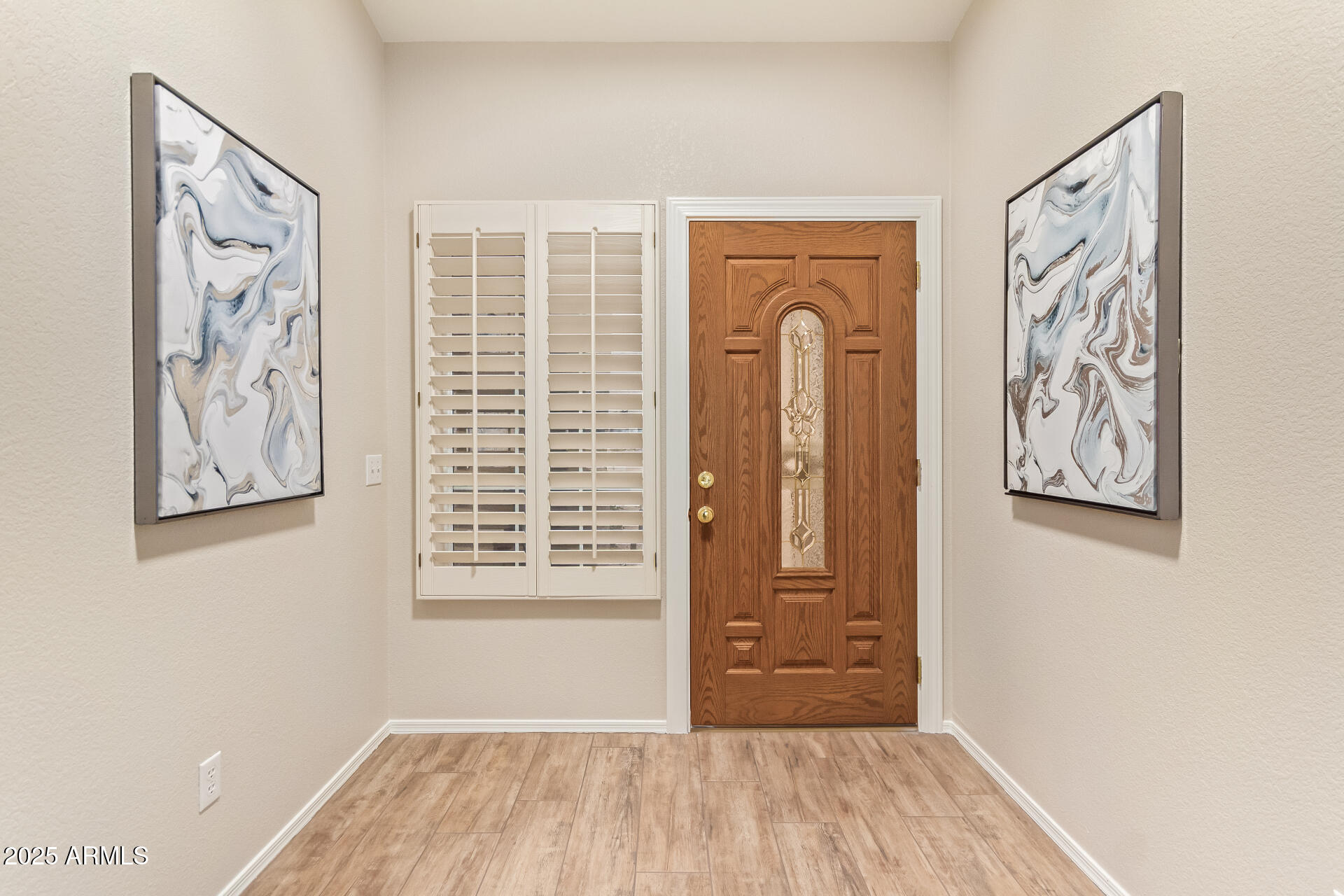 15596 West Flower Court Goodyear, AZ 85395 - Photo 5 of 35 a view of a room with wooden floor and walls