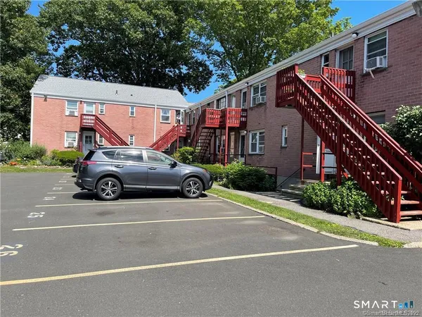 a view of a car parked in front of a house