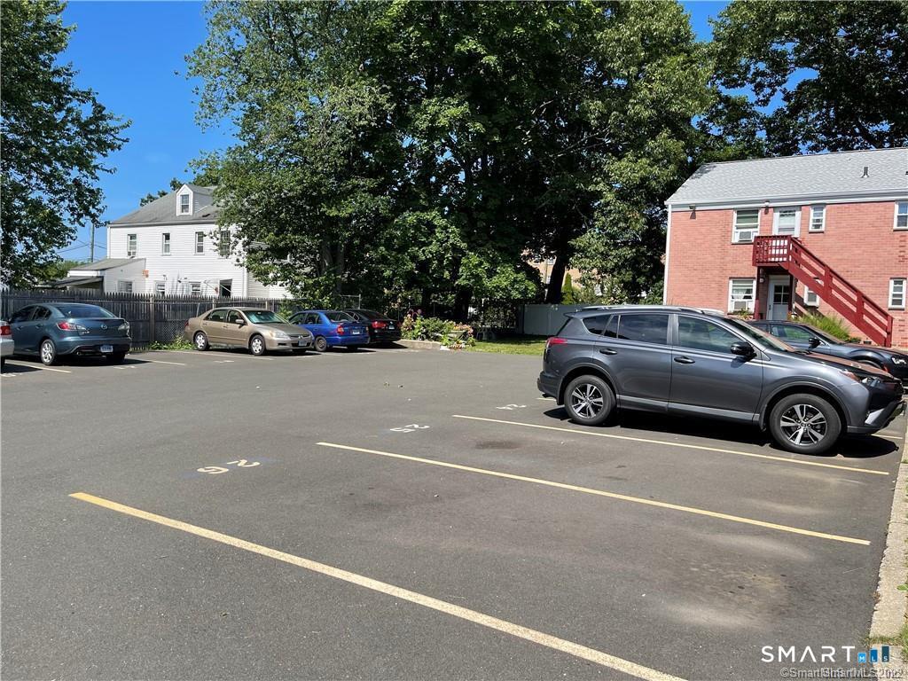 246 Seaton Road, Unit 2 Stamford, CT 06902 - Photo 15 of 18 a view of a cars parked in front of a house