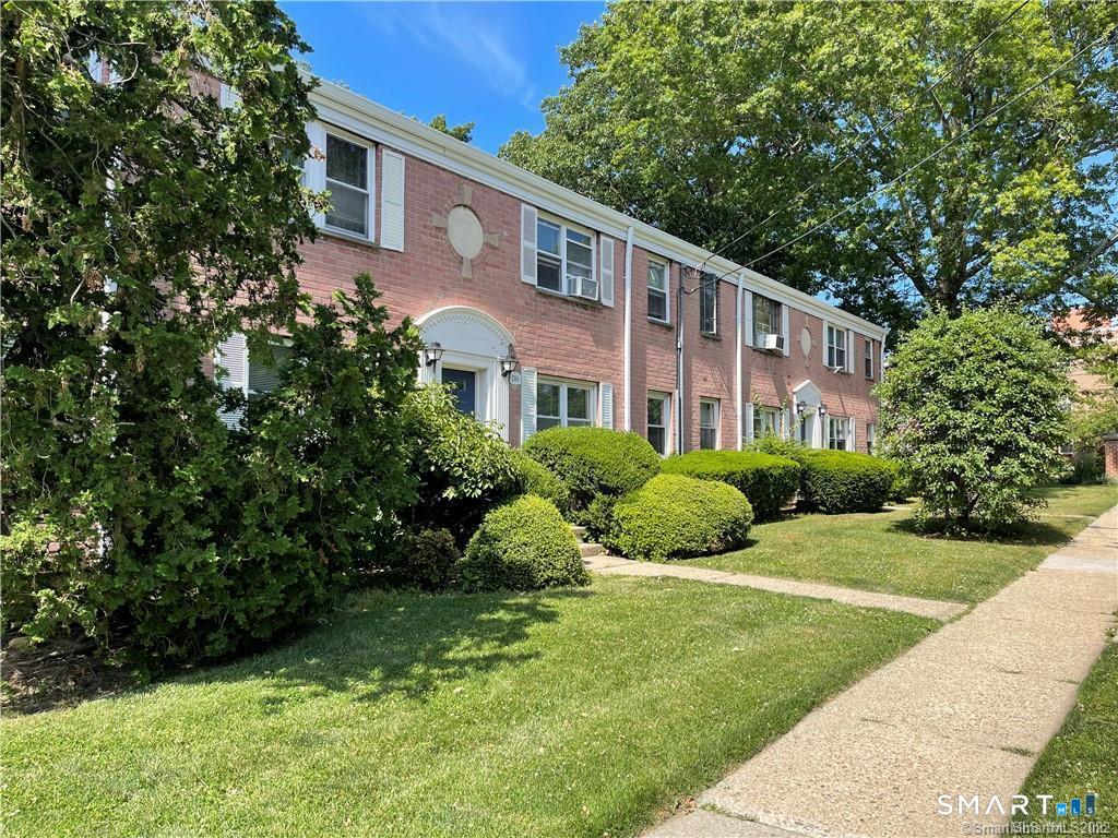 246 Seaton Road, Unit 2 Stamford, CT 06902 - Photo 16 of 18 a front view of a house with a yard
