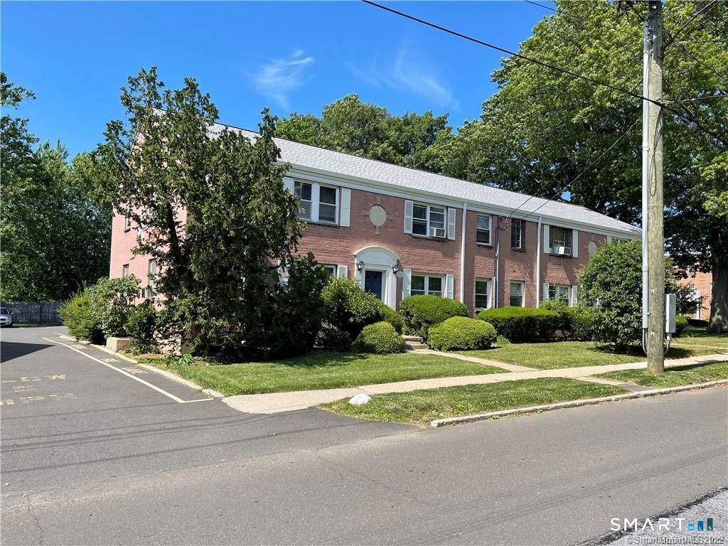 246 Seaton Road, Unit 2 Stamford, CT 06902 - Photo 2 of 18 a front view of a house with a yard