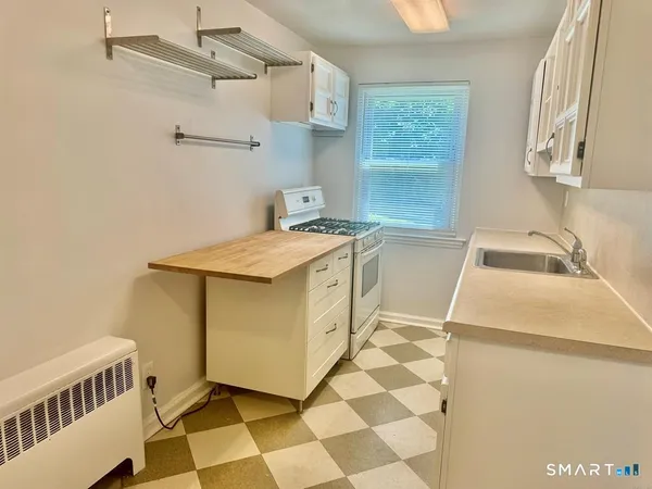 a utility room with a sink a washer and dryer