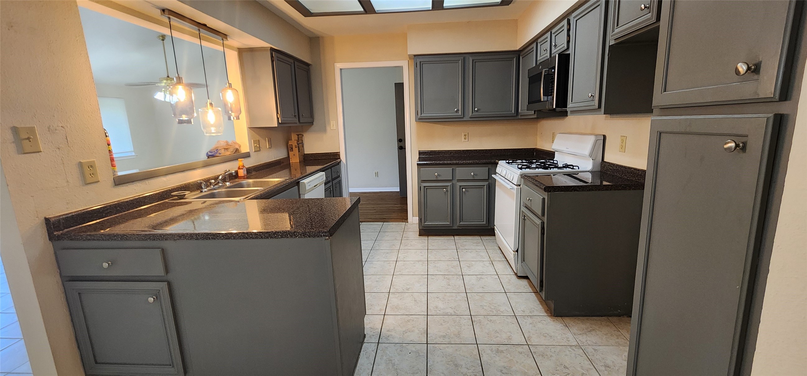 15215 Ensenada Drive Houston, TX 77083 - Photo 5 of 22 Beautiful good size Kitchen with lot of cabinets.
