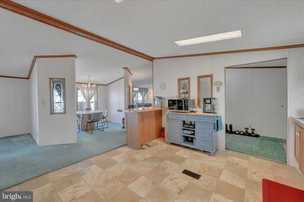 a view of a dining room with furniture and window