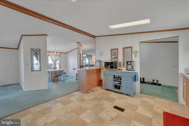 a view of a dining room with furniture and window