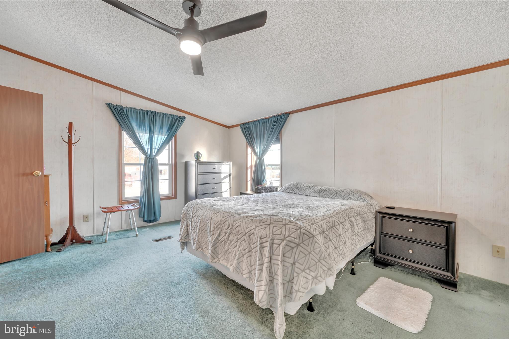 362 West Cedar Street Palmyra, PA 17078 - Photo 14 of 29 a bedroom with a large bed and a chandelier fan