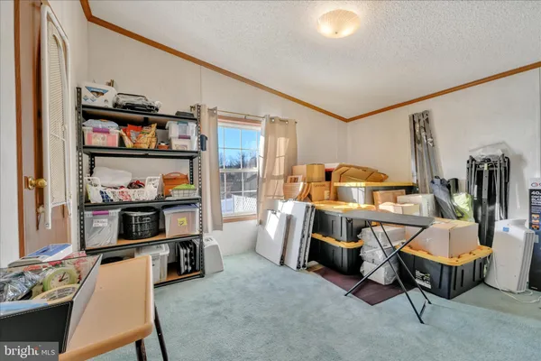 a bed room with a bed and a chandelier