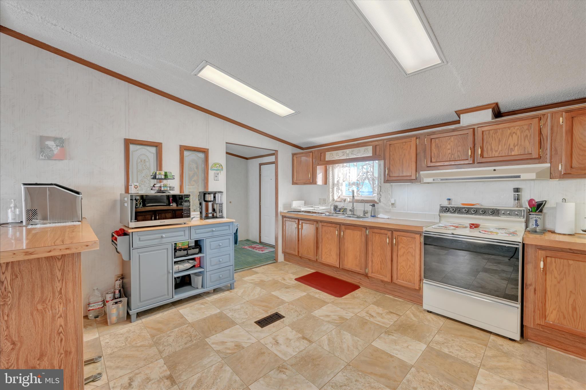 362 West Cedar Street Palmyra, PA 17078 - Photo 10 of 29 a kitchen with granite countertop a sink stove and cabinets