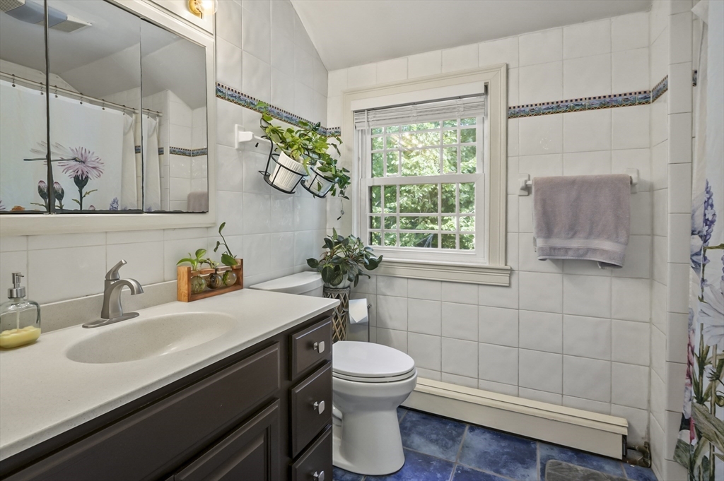 9 Oregon Road Southborough, MA 01772 - Photo 18 of 27 a bathroom with a sink a toilet and shower