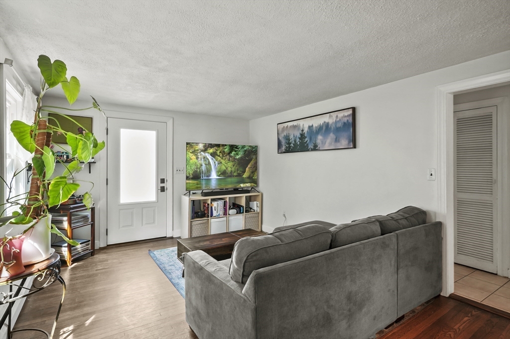 9 Oregon Road Southborough, MA 01772 - Photo 4 of 27 a living room with furniture and a potted plant