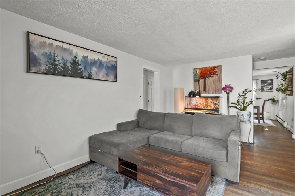 9 Oregon Road Southborough, MA 01772 - Photo 5 of 27 a living room with furniture and wooden floor