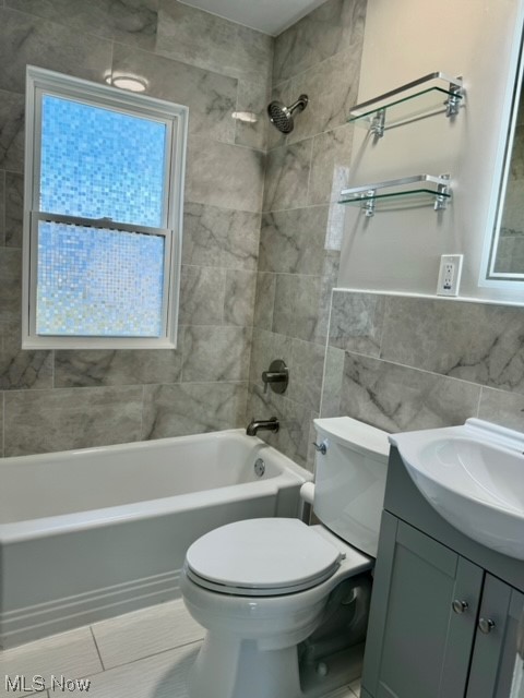 1508 Winchester Road Lyndhurst, OH 44124 - Photo 13 of 23 Full bathroom featuring tiled shower / bath combo, oversized vanity, toilet, tile walls, and tile floors
