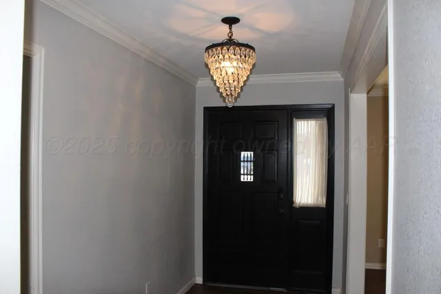 a view of a hallway with a front door