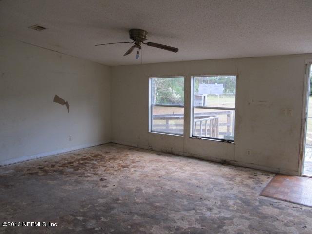 6359 Memory Lane Jacksonville, FL 32234 - Photo 2 of 11 a view of an empty room with a window