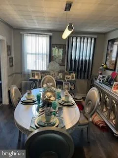 a view of a dining room with furniture and window