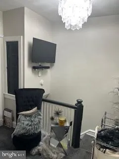 a bedroom with a bed and flat screen tv