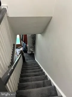 a view of entryway and kitchen