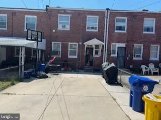 a view of a brick building with many windows