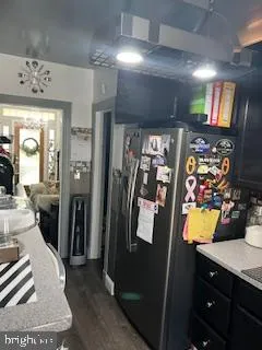 a view of a hallway with workspace and mirror