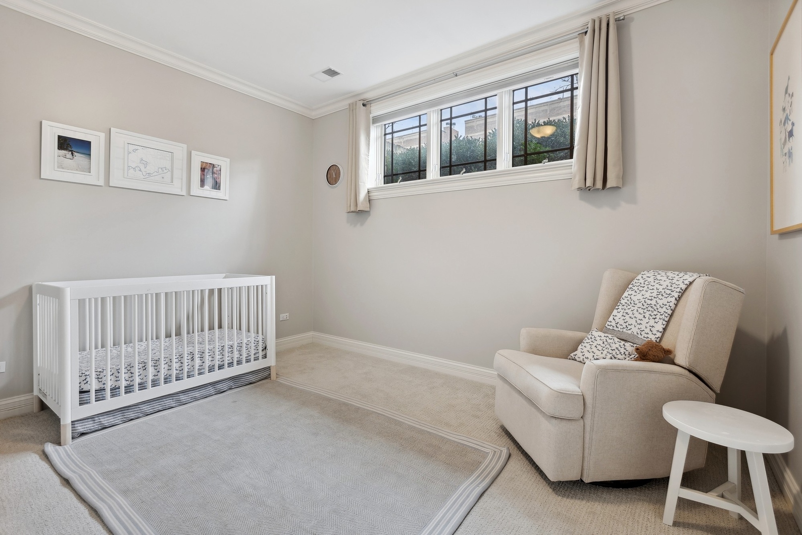 1520 West Diversey Parkway, Unit 1 Chicago, IL 60614 - Photo 17 of 31 a bedroom with furniture and baby crib