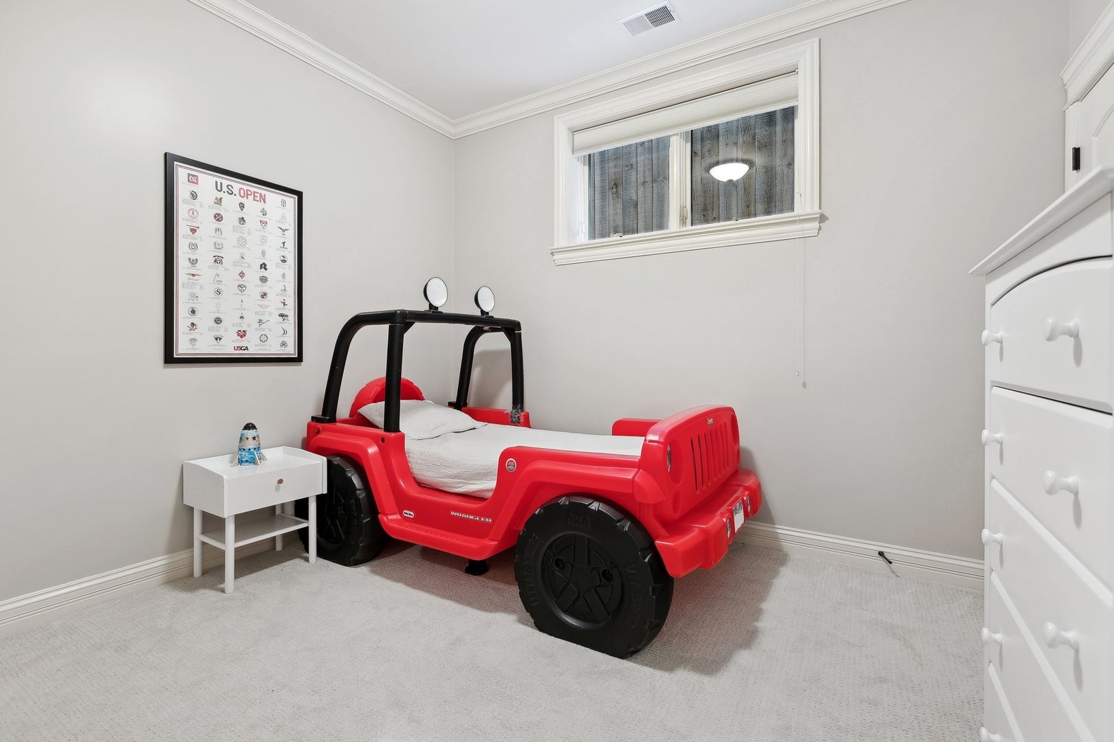 1520 West Diversey Parkway, Unit 1 Chicago, IL 60614 - Photo 19 of 31 a bedroom with a bed and a white cabinet