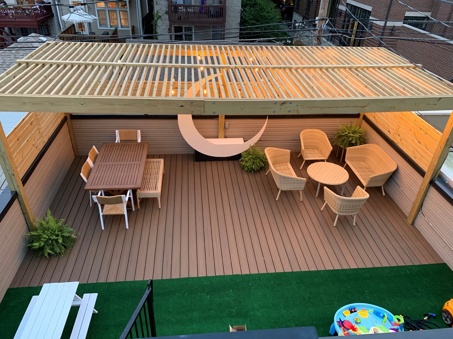 1520 West Diversey Parkway, Unit 1 Chicago, IL 60614 - Photo 28 of 31 a view of a patio with table and chairs with wooden floor and fence