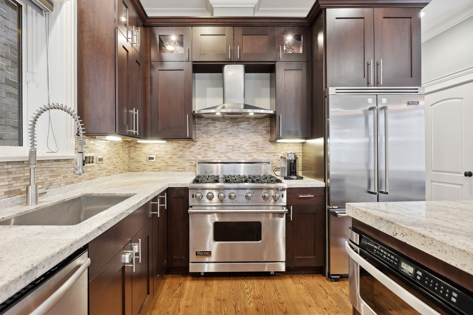 1520 West Diversey Parkway, Unit 1 Chicago, IL 60614 - Photo 8 of 31 a kitchen with a stove and a sink