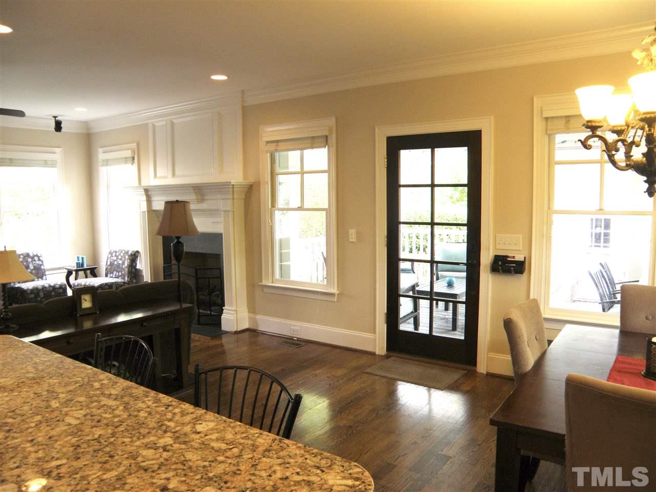 2702 Bedford Avenue Raleigh, NC 27607 - Photo 11 of 25 a view of a living room or kitchen and a wooden floor