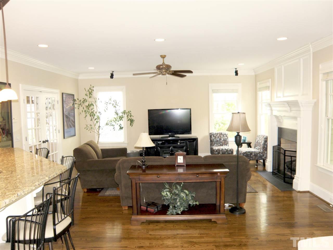 2702 Bedford Avenue Raleigh, NC 27607 - Photo 12 of 25 a living room with fireplace furniture and a flat screen tv