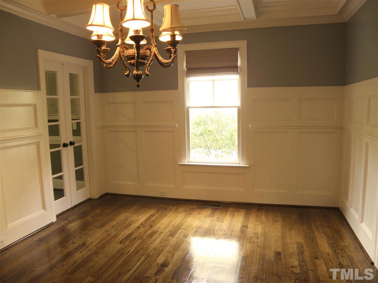 2702 Bedford Avenue Raleigh, NC 27607 - Photo 13 of 25 an empty room with wooden floor and windows